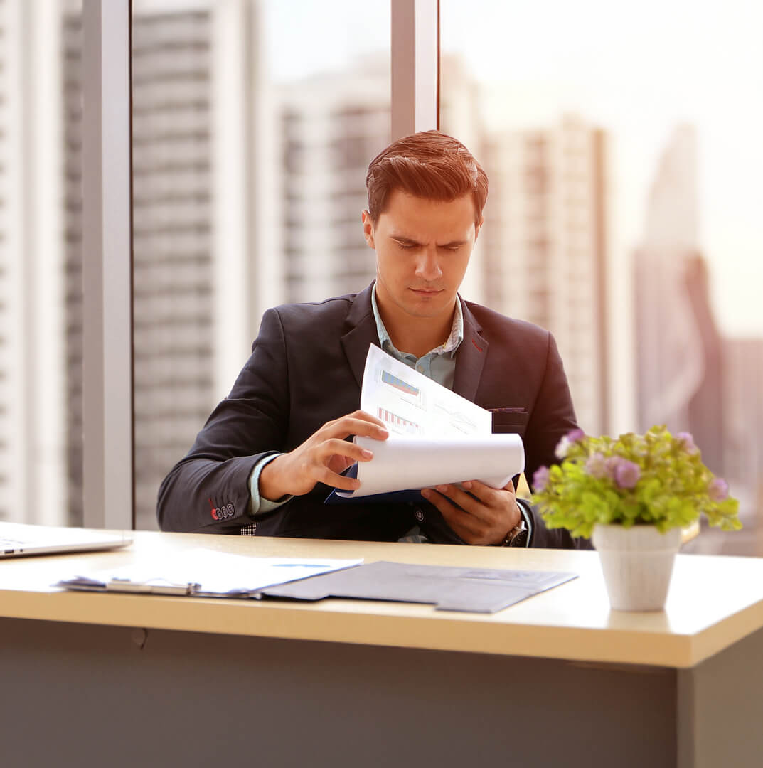 young-businesswoman-using-laptop-office 1 (1)